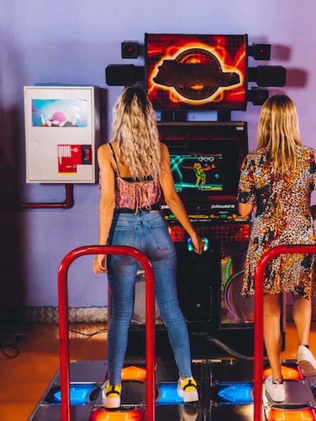 back-view-women-playing-dancing-arcade_23-2148253104