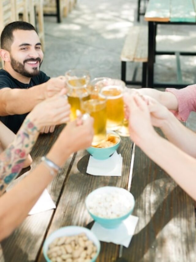 cheers-cheerful-group-friends-making-toast-with-beers-best-friends-enjoying-some-drinks-together-outdoor-bar-celebrating_662251-740