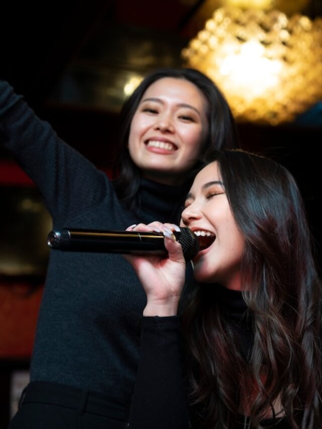 close-up-smiley-girls-singing_23-2149265146