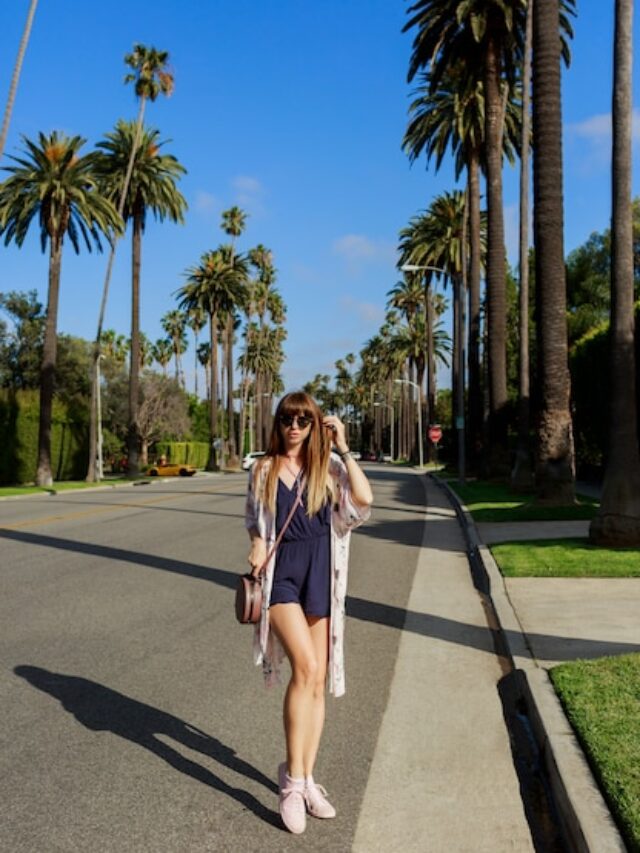 full-length-portrait-stylish-smiling-woman-walking-exotic-street-near-hotel-sunny-hot-day-spending-her-vacation-los-angeles_273443-2497