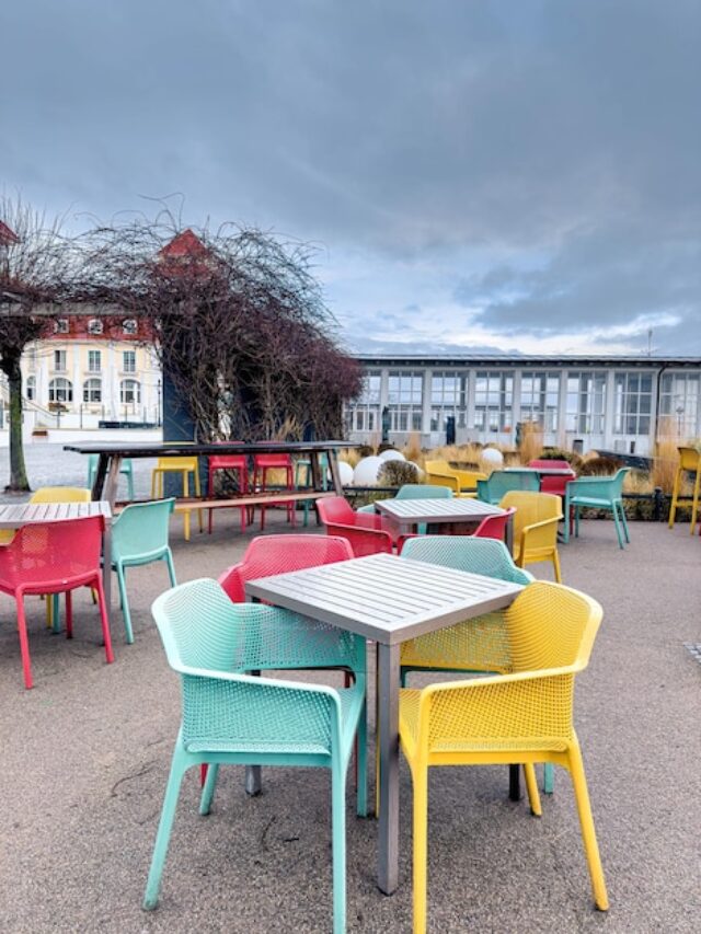 multicolored-chairs-terrace-cafe-by-sea_169016-29077